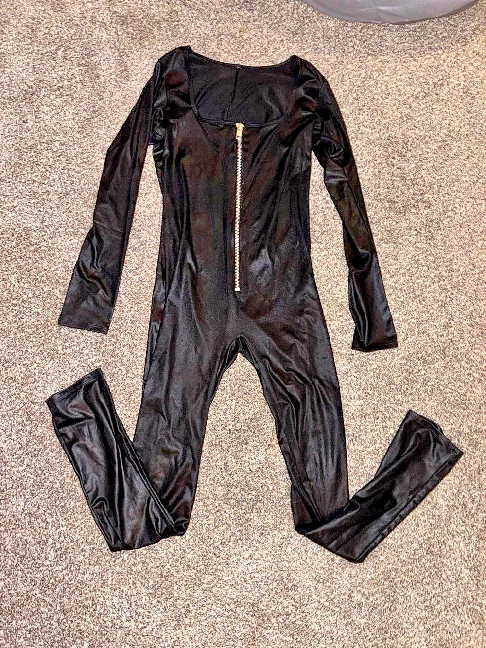 Black faux leather long sleeve jumpsuit with zipper detail